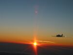 Flying towards the setting sun